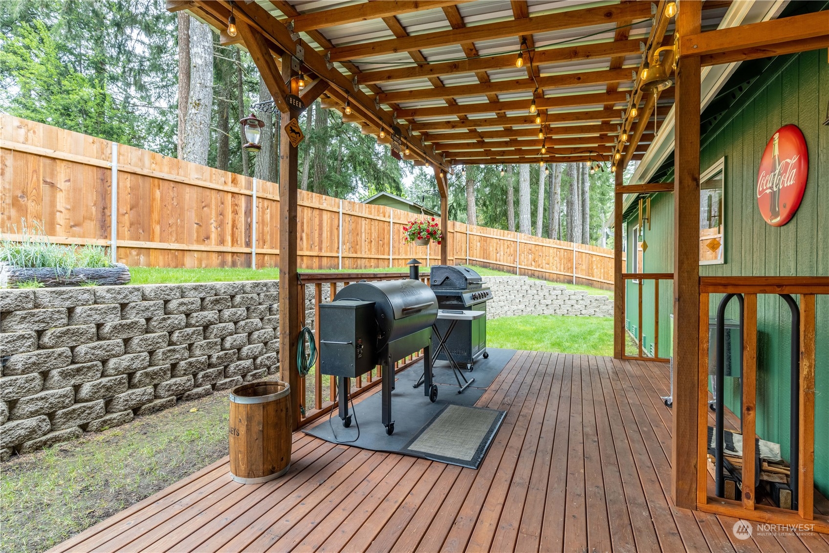 80 East Dunvegan Road Shelton, WA 98584 - Photo 15 of 24 a view of a patio with table and chairs and wooden floor