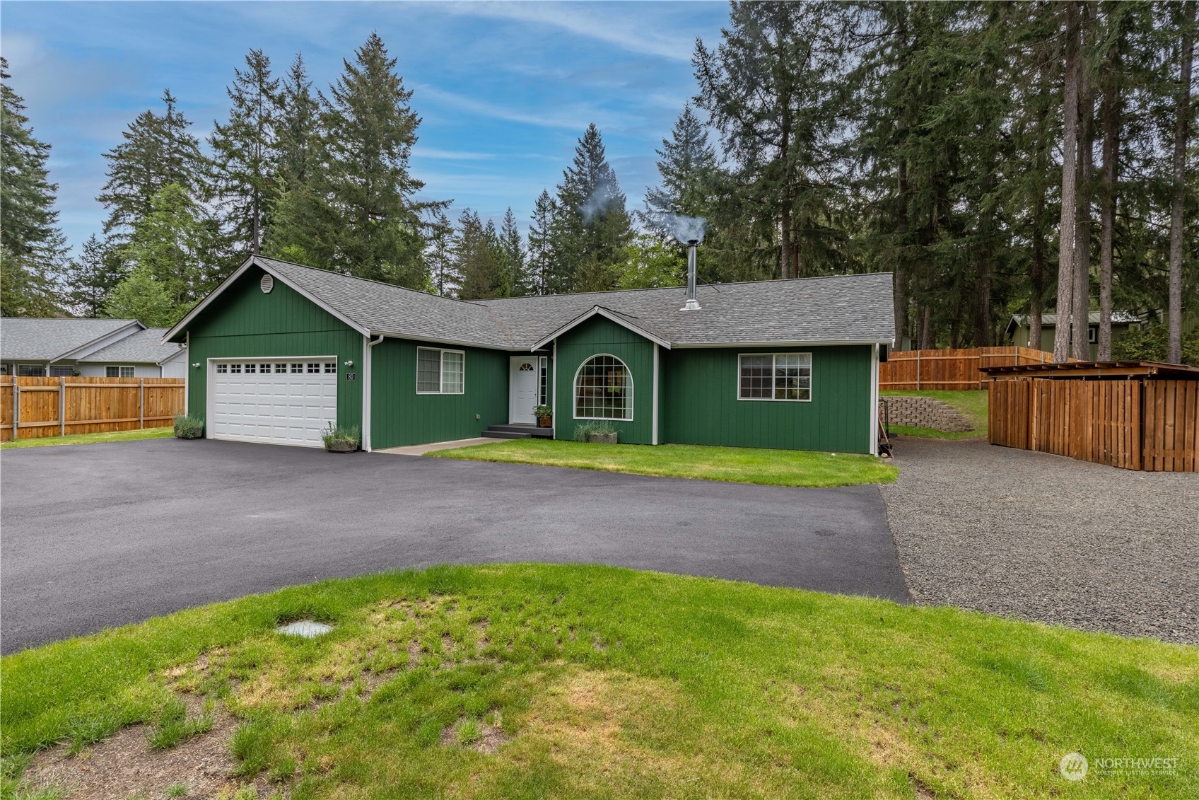 80 East Dunvegan Road Shelton, WA 98584 - Photo 17 of 24 a front view of a house with a garden and yard