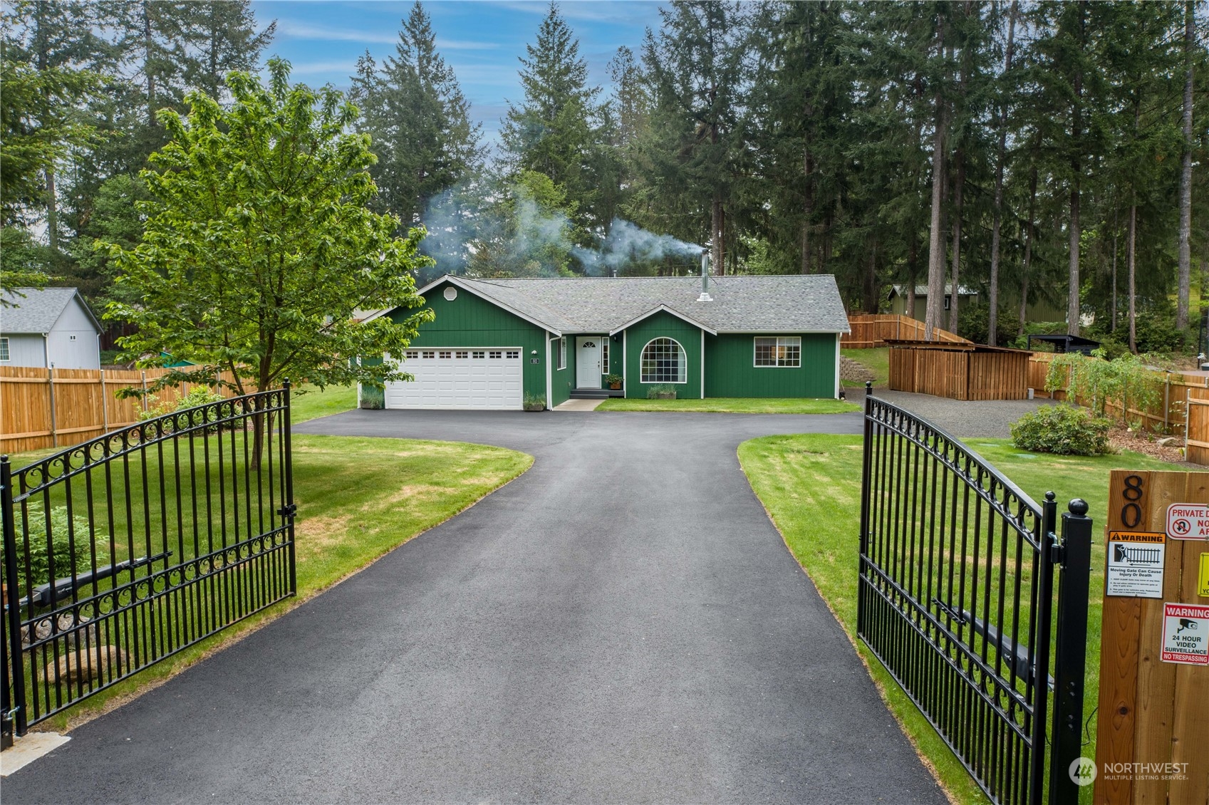 80 East Dunvegan Road Shelton, WA 98584 - Photo 18 of 24 a view of a house with backyard and a small yard