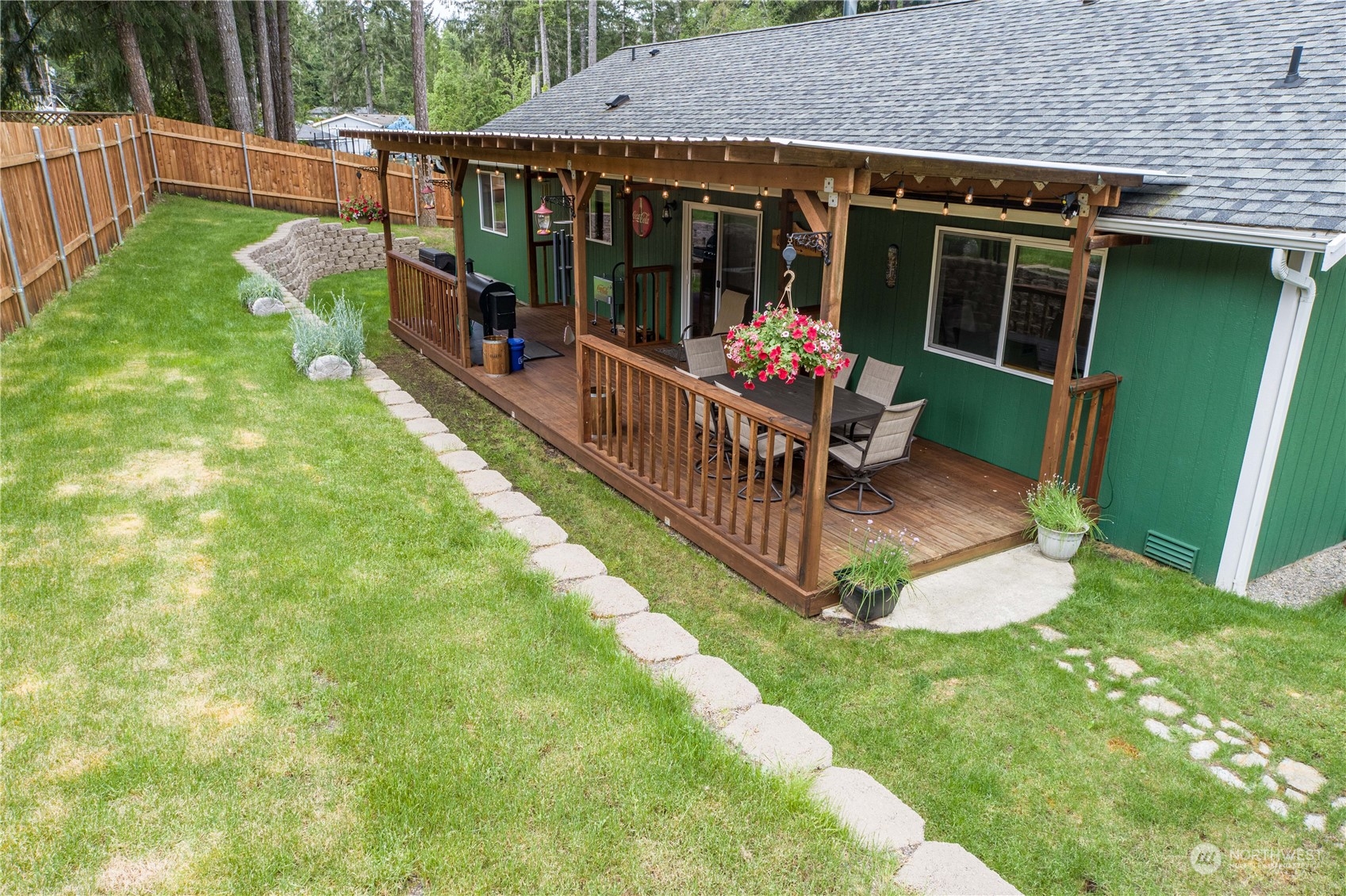80 East Dunvegan Road Shelton, WA 98584 - Photo 21 of 24 a view of a deck with chairs and a yard