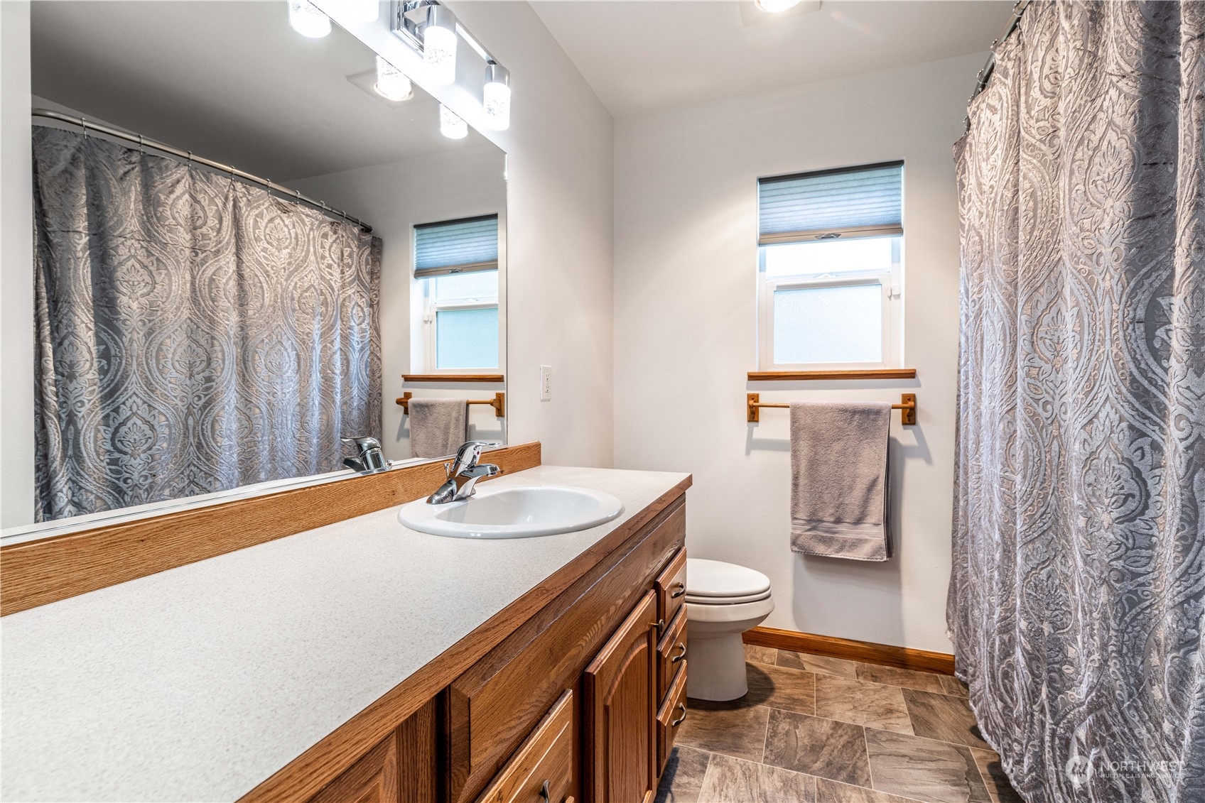 80 East Dunvegan Road Shelton, WA 98584 - Photo 9 of 24 a bathroom with a sink a toilet and a mirror