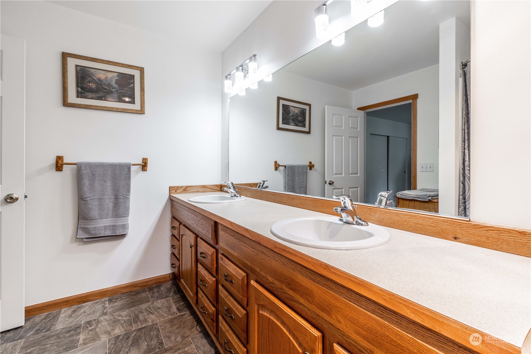 80 East Dunvegan Road Shelton, WA 98584 - Photo 10 of 24 a bathroom with a sink a vanity and a large mirror
