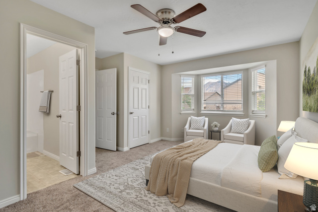 1118 North Ridge Court Spanish Fork, UT 84660 - Photo 18 of 32 Bedroom featuring light carpet, ceiling fan, and ensuite bathroom