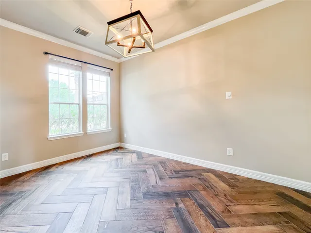 a view of a room with a window and ceiling fan