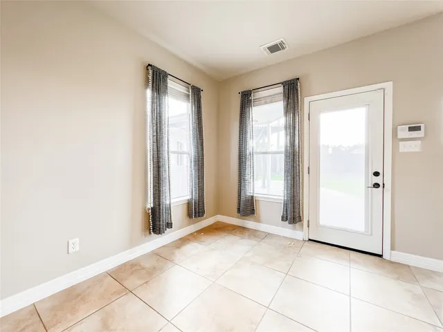 a view of a parking space with a car parked in front of it