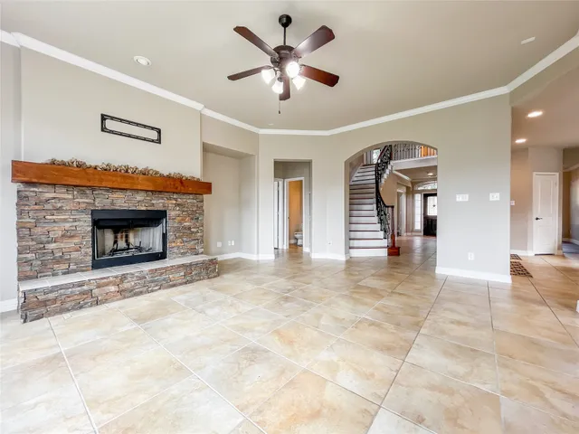 a view of an empty room with a fireplace
