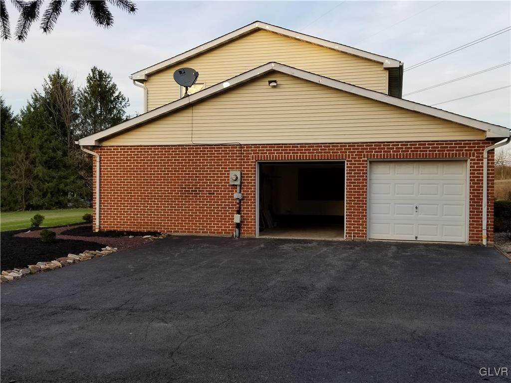 28 Millrace Road Northampton, PA 18067 - Photo 5 of 5 a front view of a house with a garage