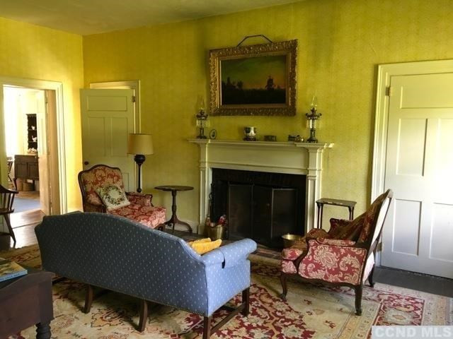 1429 County Rte 351 Rensselaerville, NY 12147 - Photo 5 of 10 a living room with furniture and a fireplace
