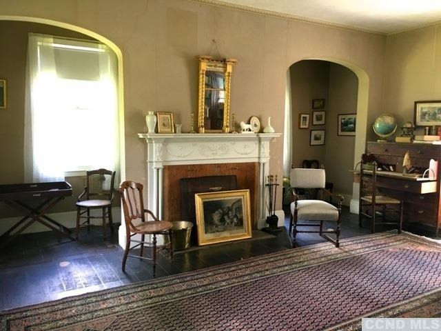 1429 County Rte 351 Rensselaerville, NY 12147 - Photo 7 of 10 a living room with furniture and a fireplace