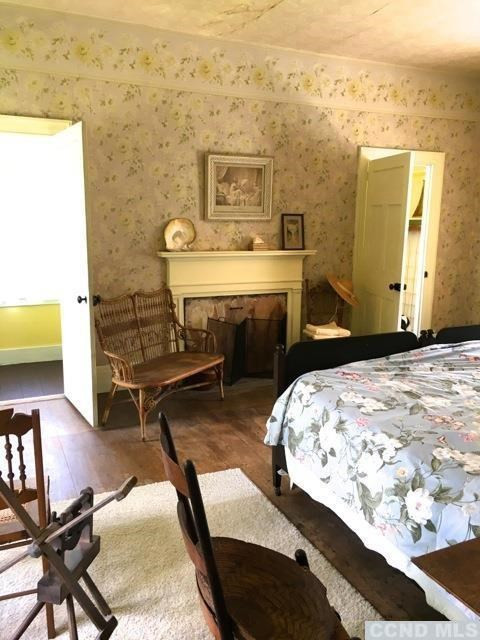 1429 County Rte 351 Rensselaerville, NY 12147 - Photo 10 of 10 a bedroom with a bed and a table in it
