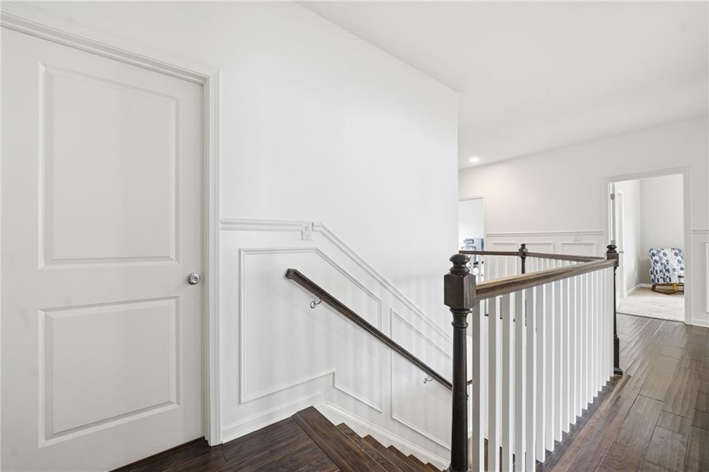 178 Fieldbrook Crossing Canton, GA 30115 - Photo 26 of 71 a view of a hallway with wooden floor and stairs