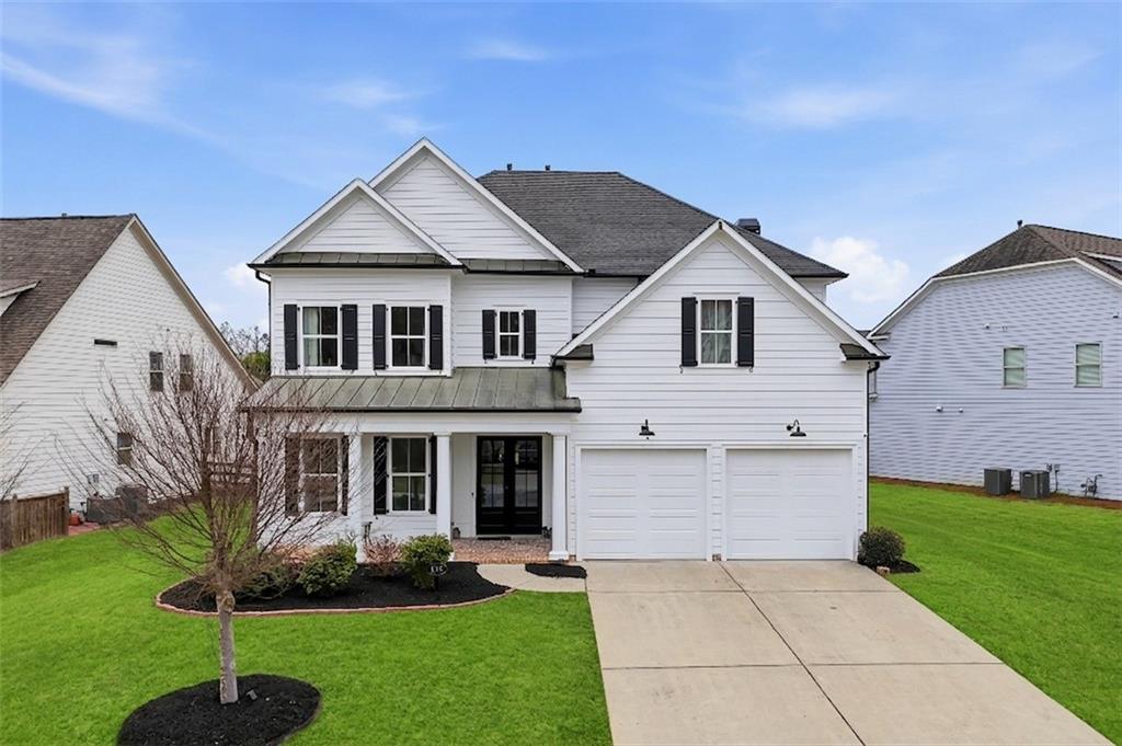 178 Fieldbrook Crossing Canton, GA 30115 - Photo 3 of 71 a front view of a house with a yard and trees