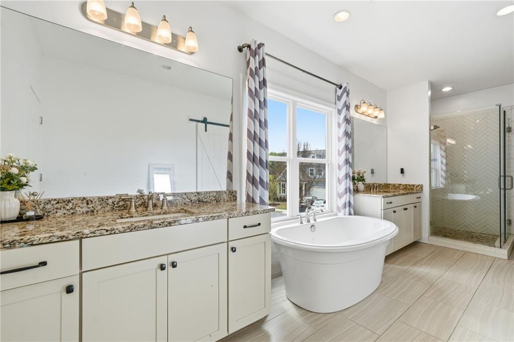 178 Fieldbrook Crossing Canton, GA 30115 - Photo 32 of 71 a bathroom with a double vanity sink a mirror and a toilet