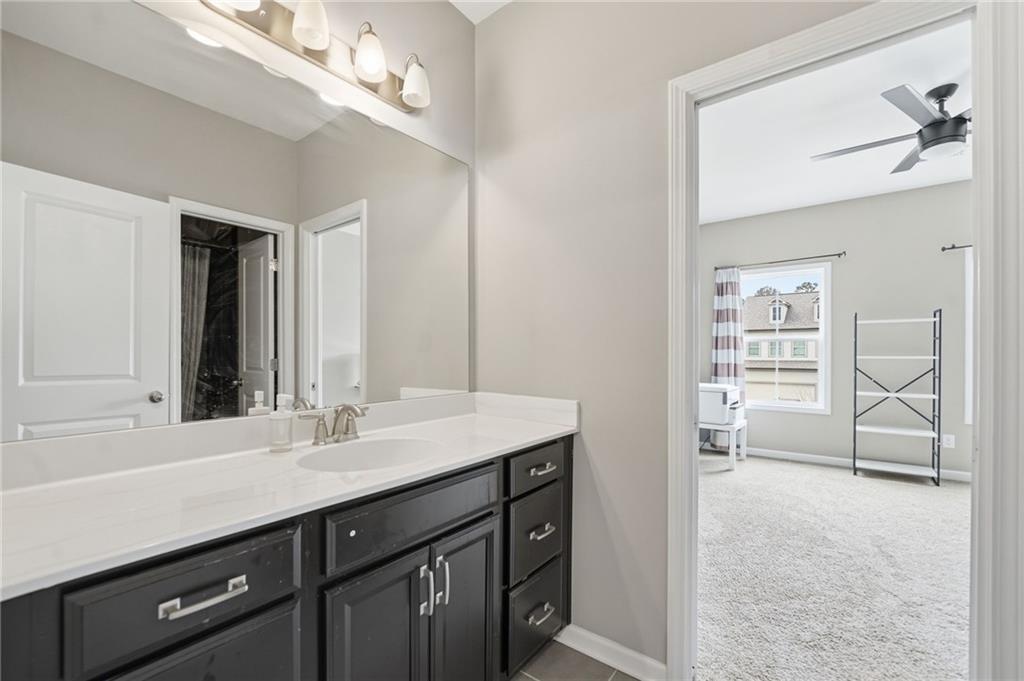178 Fieldbrook Crossing Canton, GA 30115 - Photo 45 of 71 a en suite bathroom with a double vanity sink a large mirror and a bathtub