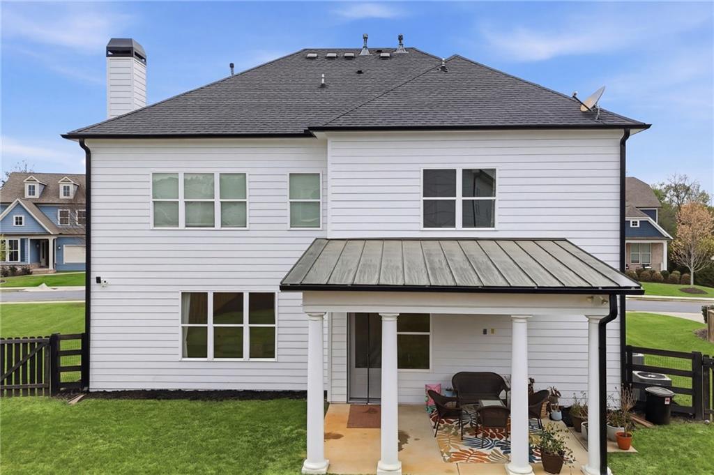 178 Fieldbrook Crossing Canton, GA 30115 - Photo 54 of 71 a front view of a house with a garden and plants