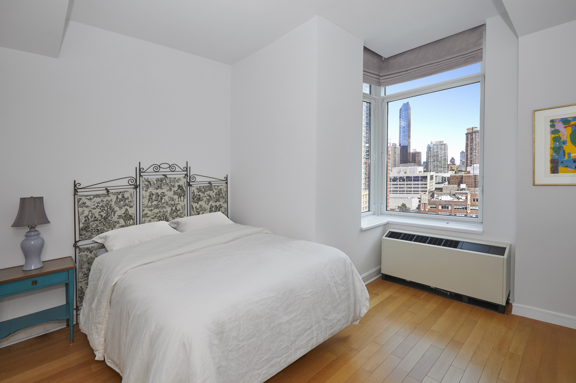 80 Riverside Boulevard, Unit 19B Manhattan, NY 10069 - Photo 8 of 18 a bedroom with a bed and a window