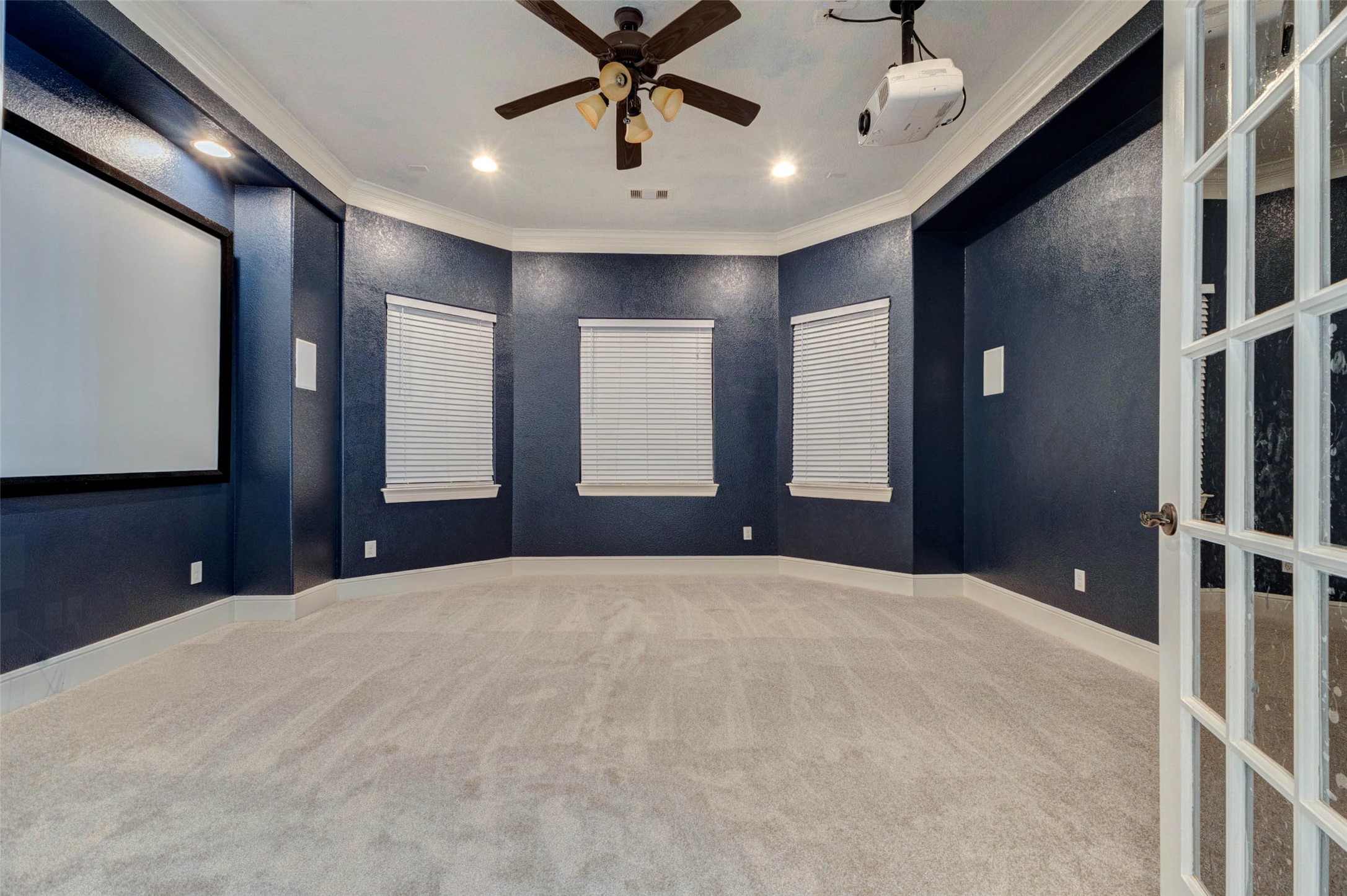 5327 Whitmore Fulshear, TX 77441 - Photo 28 of 50 The dedicated media room comes complete with projector and screen, creating the ultimate destination for movie nights, gaming, and watching the big game.