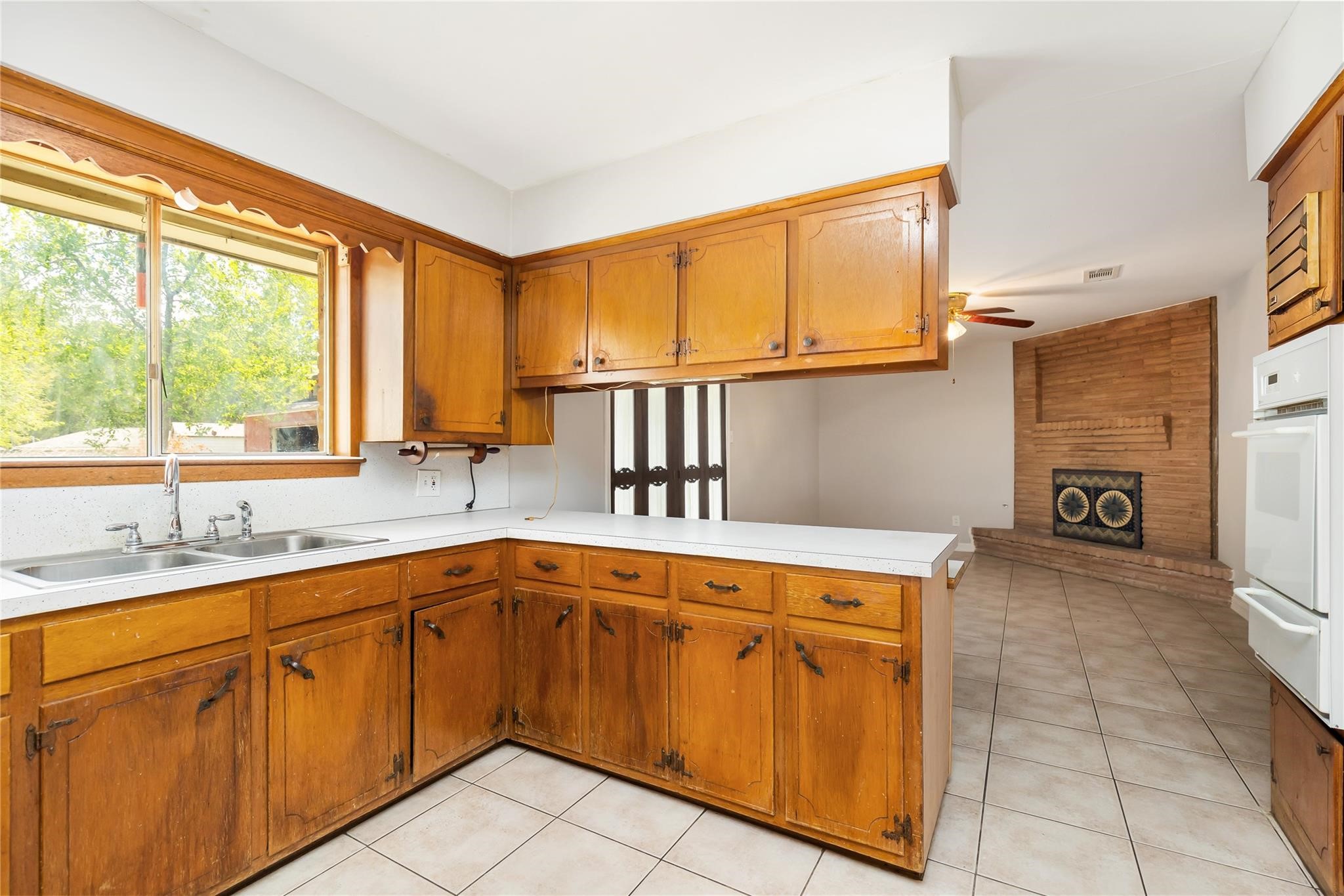 29518 West Hawthorne Drive Spring, TX 77386 - Photo 13 of 22 a kitchen with a sink stove and cabinets
