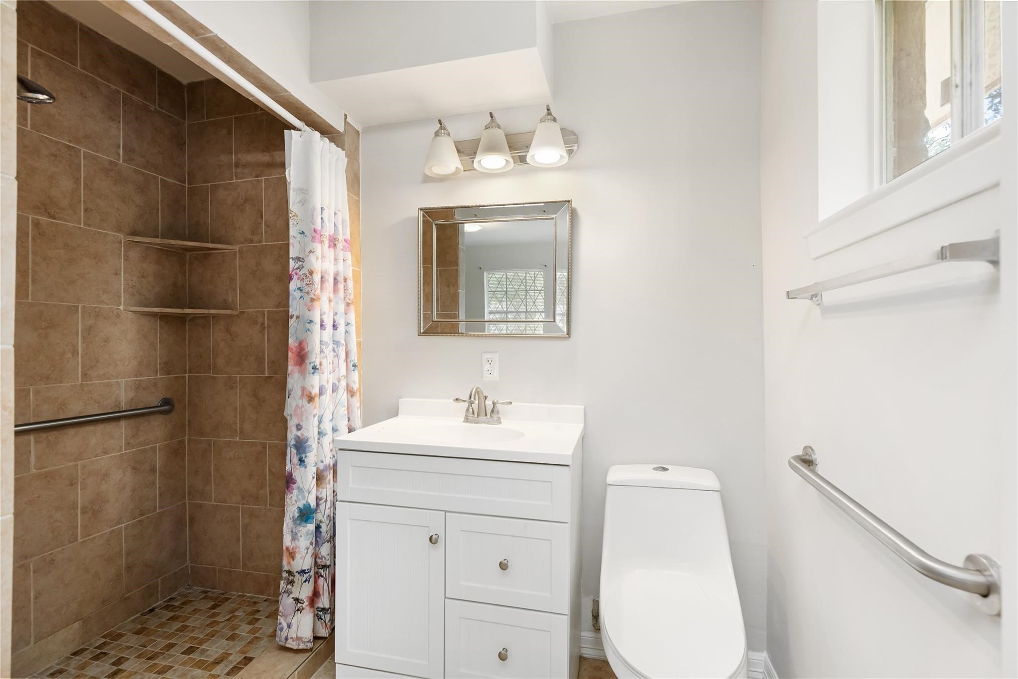 29518 West Hawthorne Drive Spring, TX 77386 - Photo 16 of 22 a bathroom with a sink mirror vanity and toilet