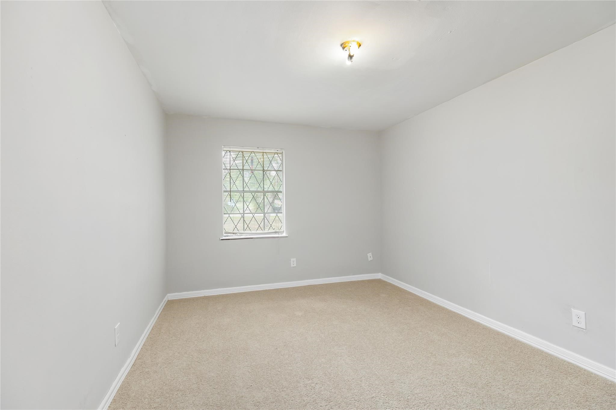 29518 West Hawthorne Drive Spring, TX 77386 - Photo 17 of 22 an empty room with a window