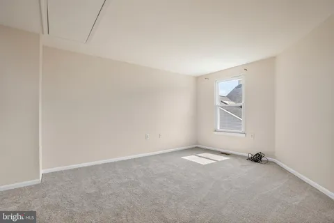 a view of a room that has a window in it