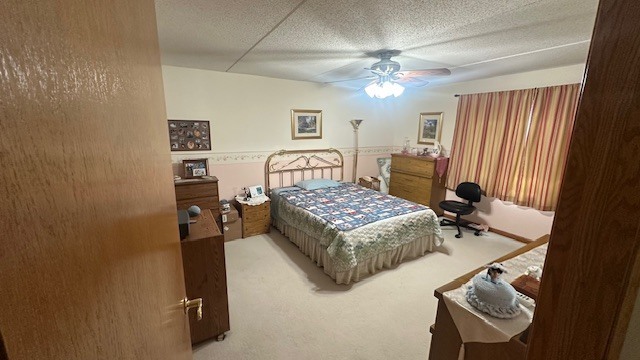 8560 West Foster Avenue, Unit 604 Norridge, IL 60706 - Photo 4 of 8 a bedroom with a bed and a chandelier