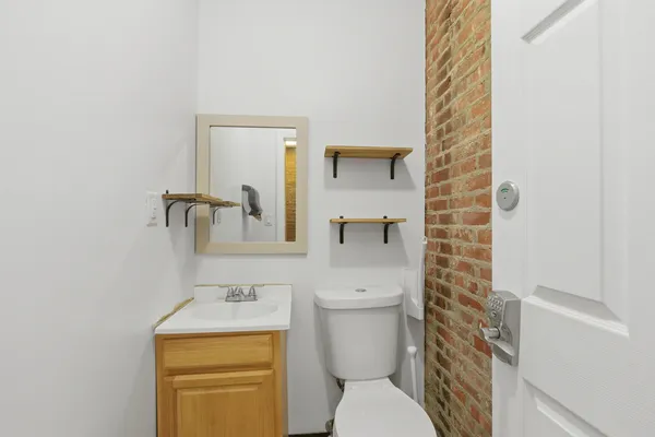 a bathroom with a toilet and a sink