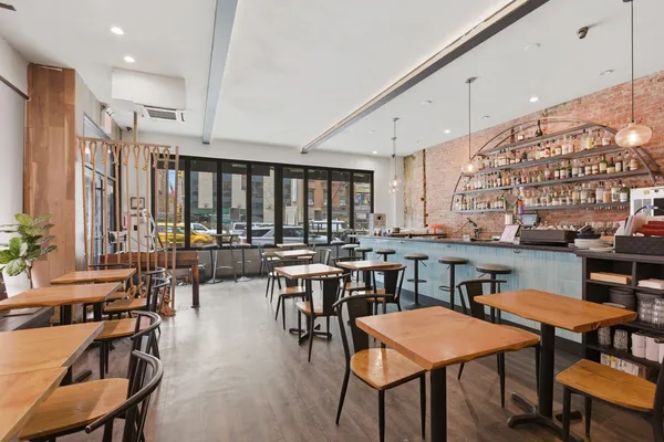 a view of a a dining room with furniture window and outside view