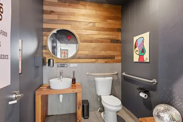 a bathroom with a toilet and a sink