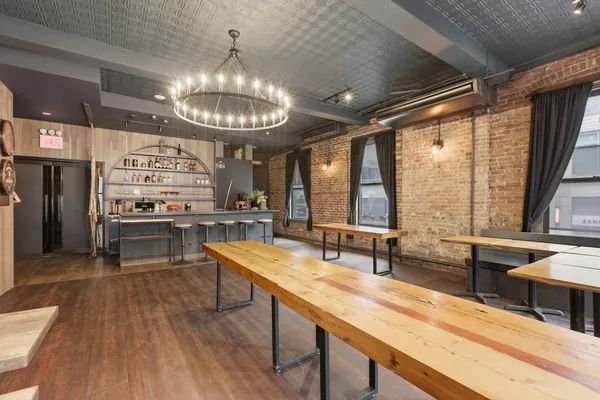 a kitchen with stainless steel appliances granite countertop a stove and a wooden floors