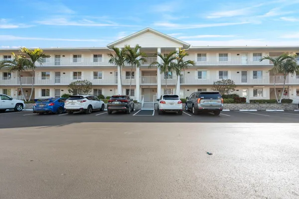a building with cars parked in front of it