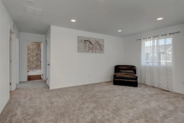 a view of room with stairs and a window