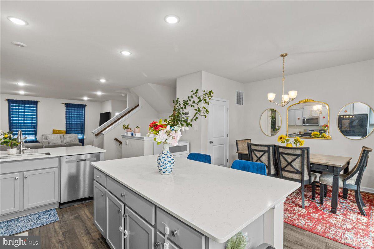 9 Sister's Farmstead Road Mount Laurel, NJ 08054 - Photo 18 of 43 a kitchen with a table chairs stove and cabinets