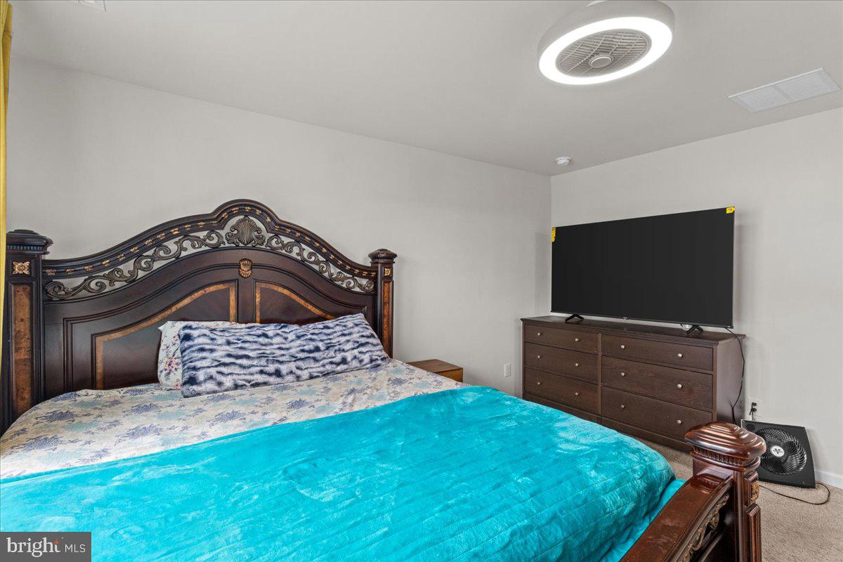 9 Sister's Farmstead Road Mount Laurel, NJ 08054 - Photo 25 of 43 a bedroom with a bed and a flat screen tv