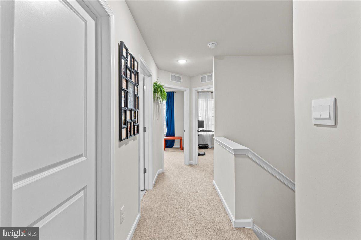 9 Sister's Farmstead Road Mount Laurel, NJ 08054 - Photo 28 of 43 a hallway with white cabinets and refrigerator