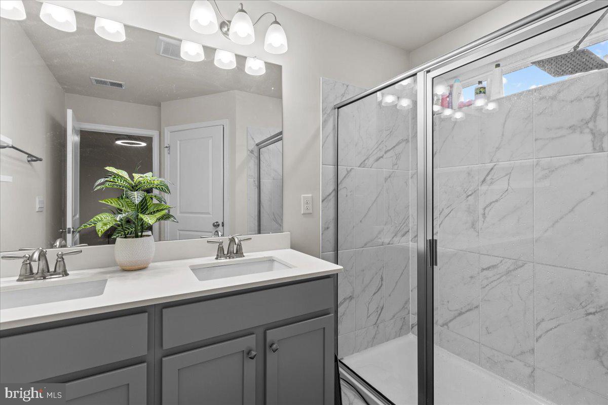 9 Sister's Farmstead Road Mount Laurel, NJ 08054 - Photo 29 of 43 a bathroom with a sink and a mirror