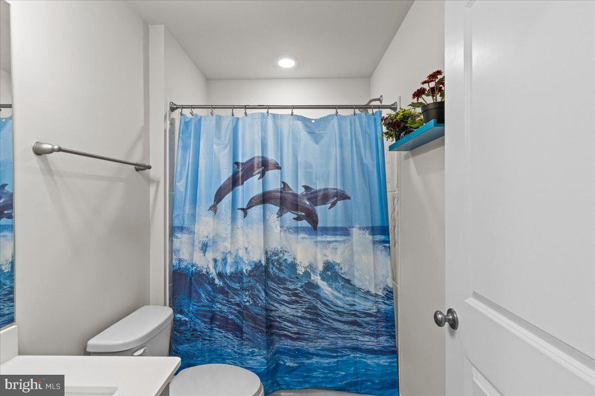9 Sister's Farmstead Road Mount Laurel, NJ 08054 - Photo 38 of 43 a bathroom with a toilet and a shower curtain