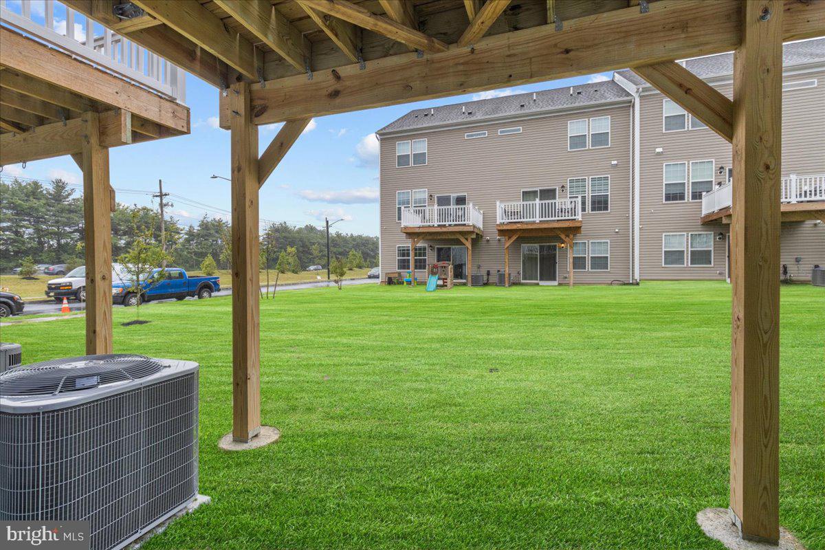 9 Sister's Farmstead Road Mount Laurel, NJ 08054 - Photo 43 of 43 a view of a patio with a table chairs and a yard