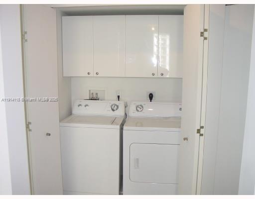 901 Brickell Key Boulevard, Unit 705 Miami, FL 33131 - Photo 25 of 41 a utility room with dryer and washer