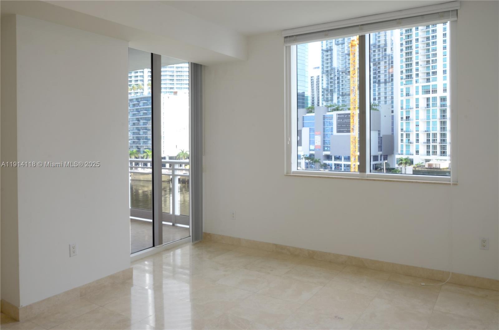 901 Brickell Key Boulevard, Unit 705 Miami, FL 33131 - Photo 7 of 41 a view of an empty room with a window