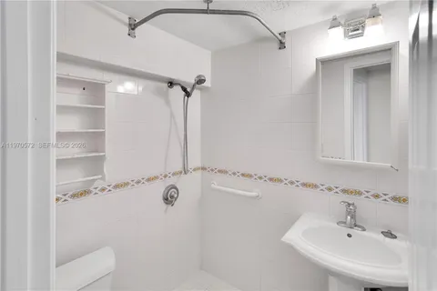 a bathroom with a sink and shower