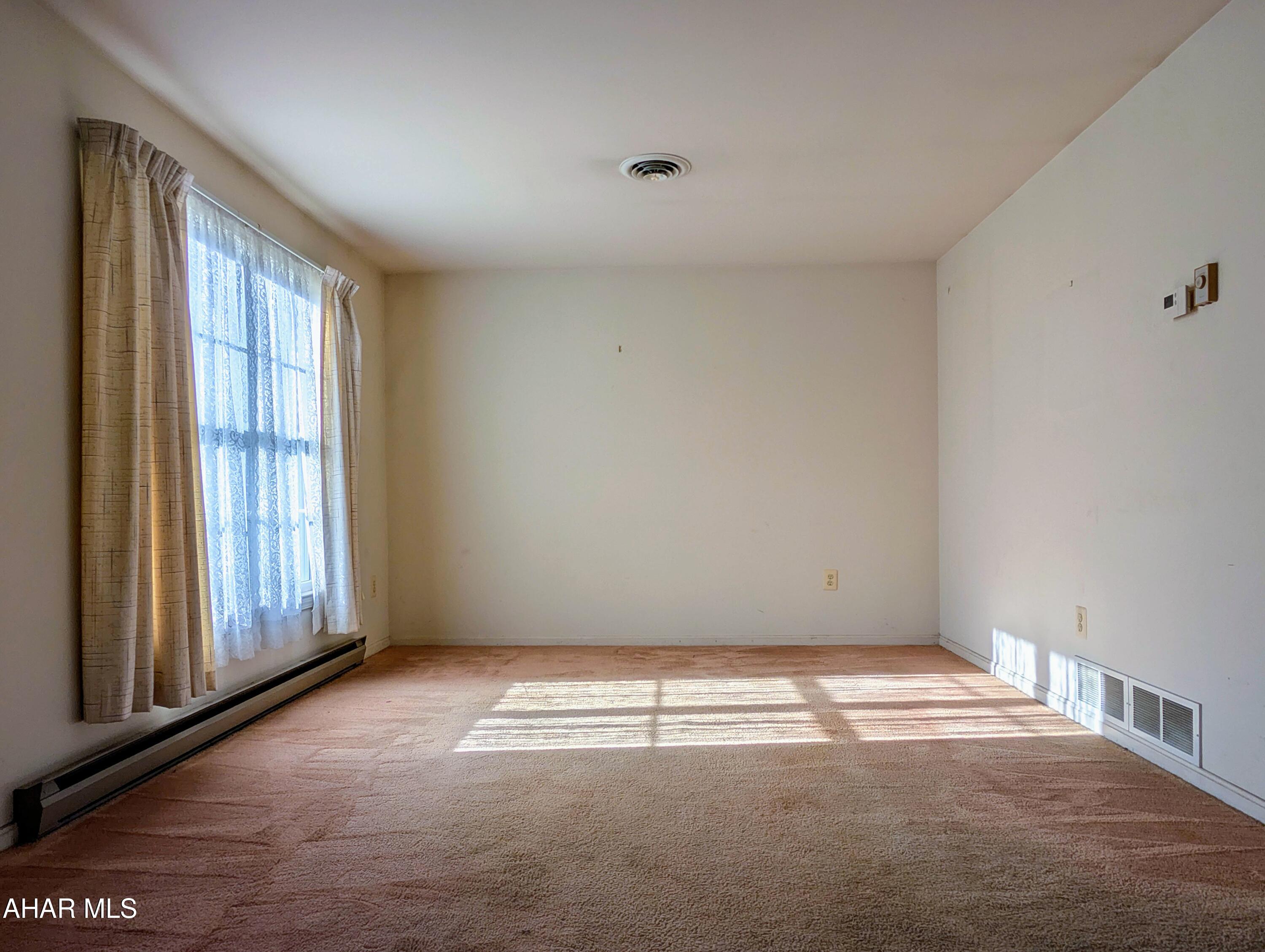 147 Pine Street Hyndman, PA 15545 - Photo 14 of 44 a view of empty room with window