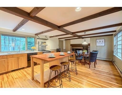99 Herrick Road Boxford, MA 01921 - Photo 12 of 30 a dining hall with stainless steel appliances granite countertop a stove and a view of living room with furniture