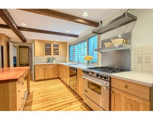 99 Herrick Road Boxford, MA 01921 - Photo 13 of 30 a kitchen with stainless steel appliances granite countertop a stove and a refrigerator