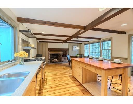 99 Herrick Road Boxford, MA 01921 - Photo 16 of 30 a living room with furniture a fireplace and a table