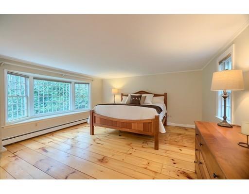 99 Herrick Road Boxford, MA 01921 - Photo 24 of 30 a bedroom with a bed and a lamp