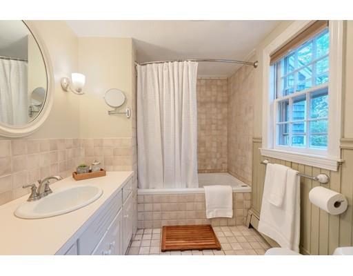 99 Herrick Road Boxford, MA 01921 - Photo 25 of 30 a bathroom with a sink a toilet a tub and a mirror