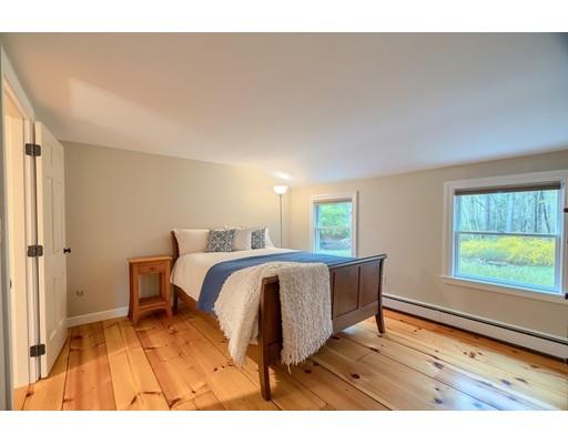 99 Herrick Road Boxford, MA 01921 - Photo 27 of 30 a spacious bedroom with a bed and a window