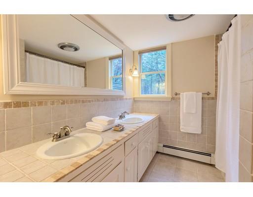 99 Herrick Road Boxford, MA 01921 - Photo 30 of 30 a bathroom with a sink double vanity granite tub shower and mirror