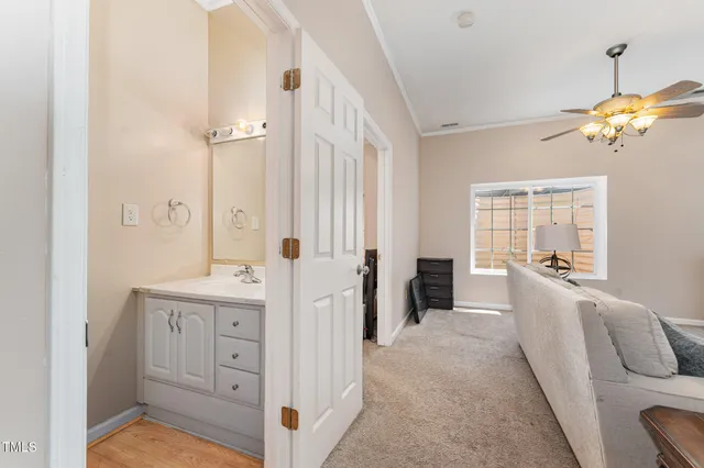 a view of a bathroom with dual sinks